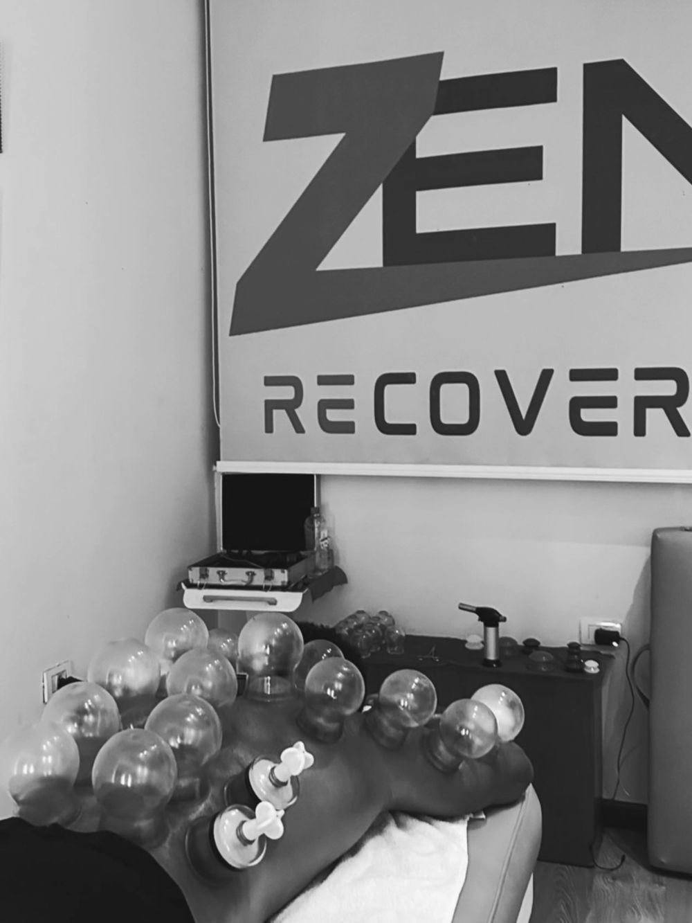 The Zen Recovery studio wall and a fire-cupping session